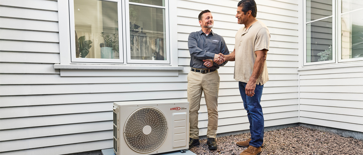 Homeowners choosing between ducted and ductless heat pumps with dealer guidance